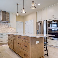Warm-Creamy-White-Painted-Cabinetry-Paired-Organic-Wood-Grained-Timber-Kitchen-Remodel-in-East-York 6